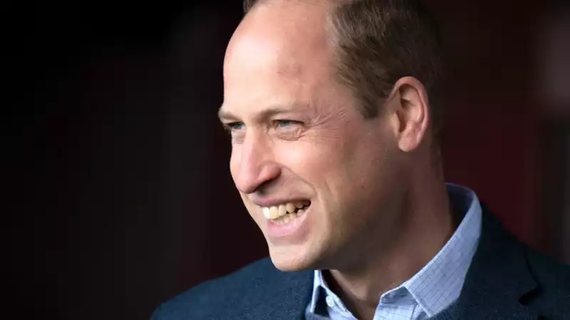 Prince William hugs his grandfather in Glasgow.