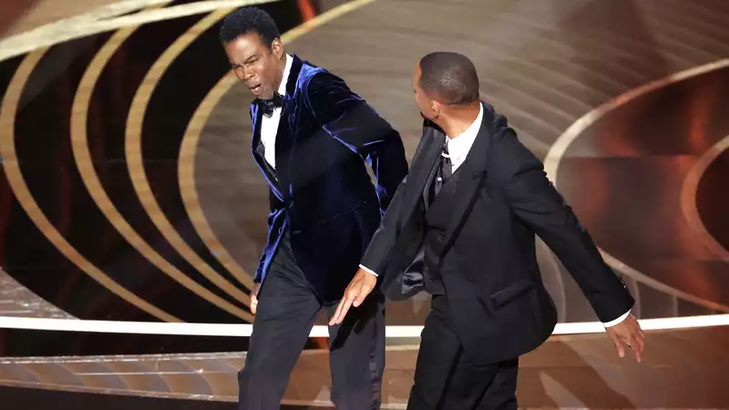 Will Smith punches Chris Rock at the 2022 Oscars