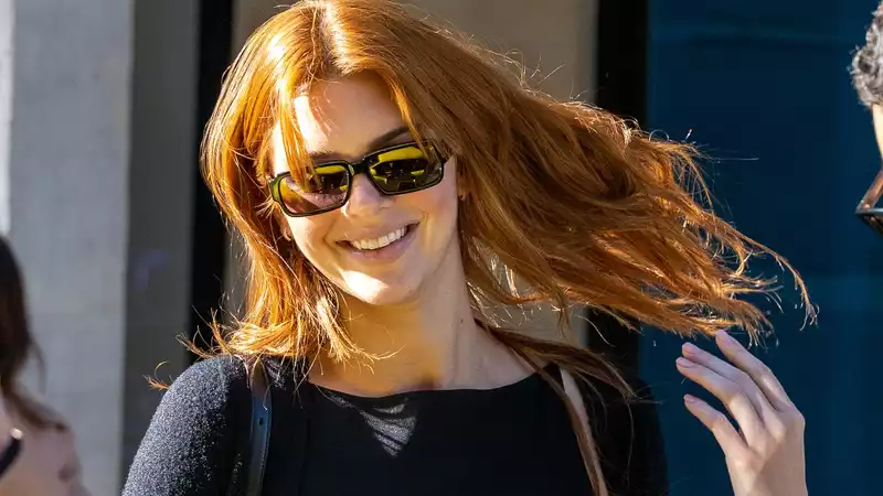 Kendall Jenner has red hair and a Julia Roberts vibe.