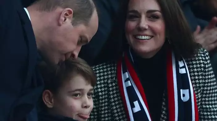 Surprise Prince George joins his parents, Kate Middleton and Prince William, at a rugby match