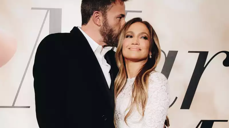 Jennifer Lopez attends a screening of "Let's Get Married" in a wedding dress, accompanied by Ben Affleck.