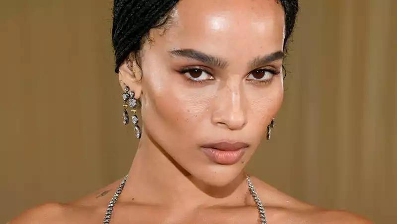 Zoe Kravitz responds to commentator who criticized her Met Gala dress.