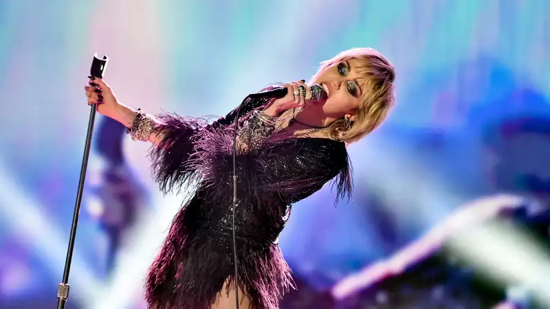 Miley Cyrus collapses while performing "Wrecking Ball" at the Super Bowl.