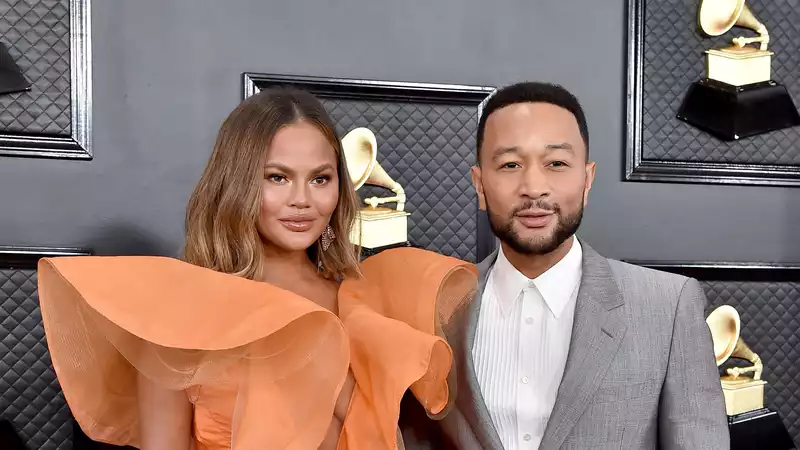 John Legend and Chrissy Teigen with matching tattoos to commemorate the birth of their son, Jack.