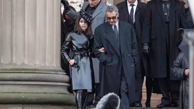 Zoe Kravitz dressed as Catwoman on the set of "Batman," wearing patent leather from head to toe.