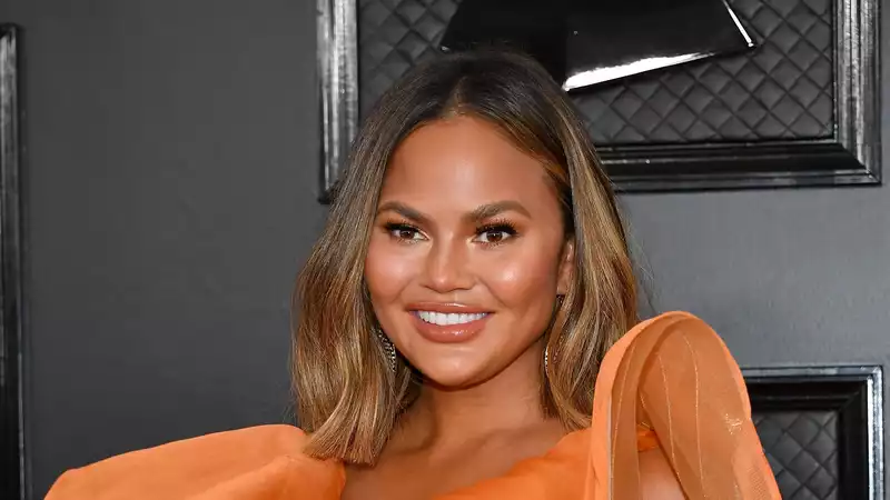 Chrissy Teigen reveals that she rested in bed for two weeks while pregnant with her third child.