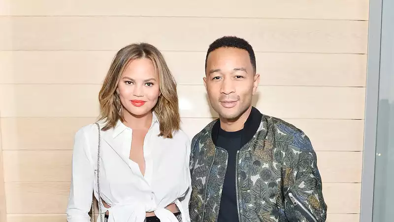 Chrissy Teigen didn't know she was pregnant when she got breast implants.