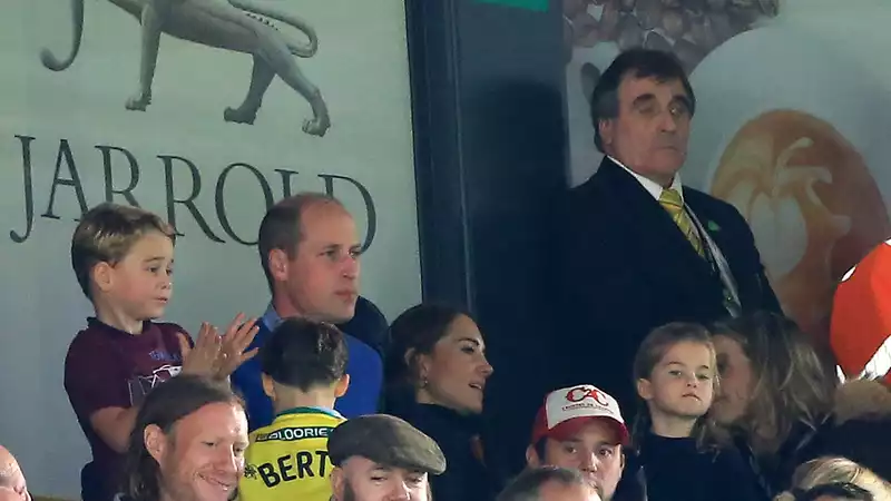 Prince William had to stop Prince George from cheering at his first professional soccer game.