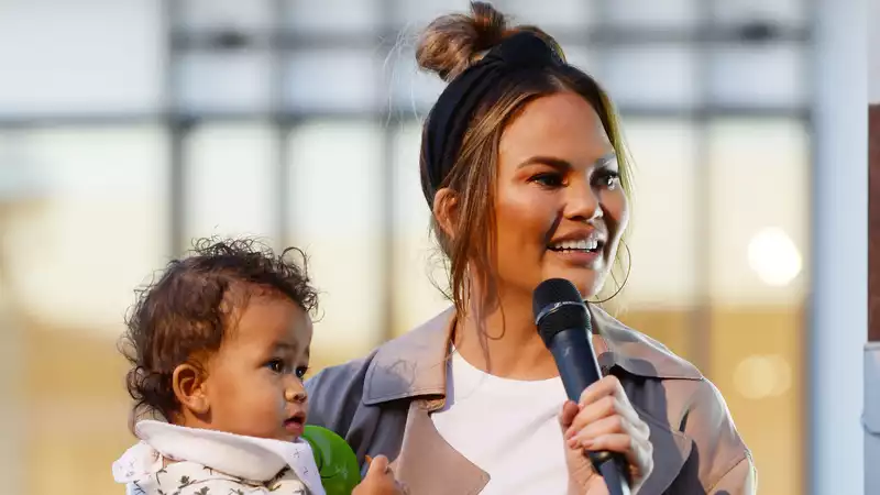 Chrissy Teigen presents her son Miles with a baby bearded dragon for his birthday.