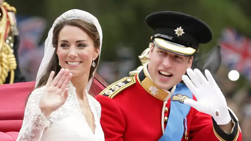 Prince William treats Kate Middleton's hair on her wedding day.