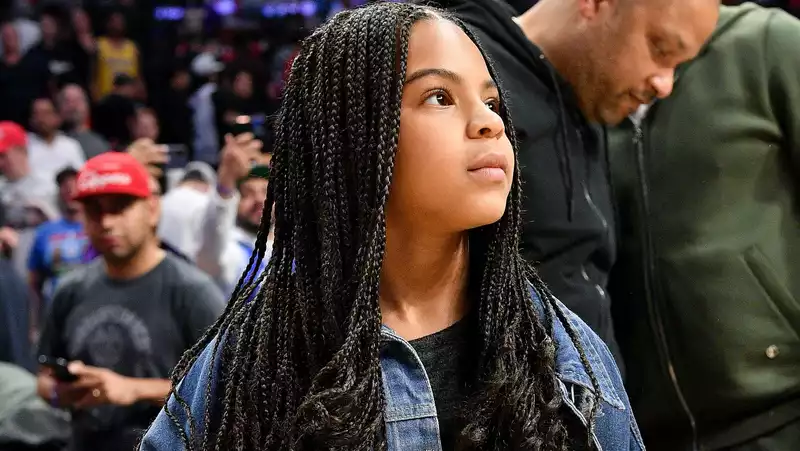 Blue Ivy, "Blue is My Name" jean jacket with Fendi boots.