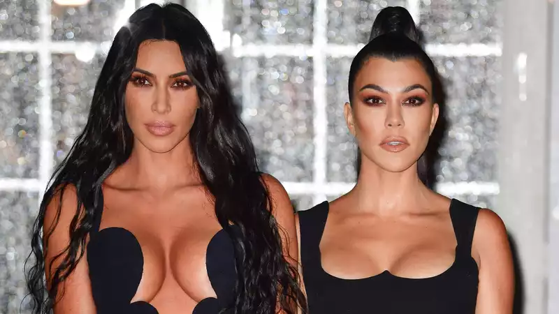 Kim and Kourtney Kardashian throw punches in a fight that gets "a little violent" on "KUWTK"