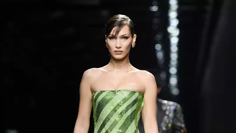 Bella Hadid wears 90's style tube dress on Versace runway