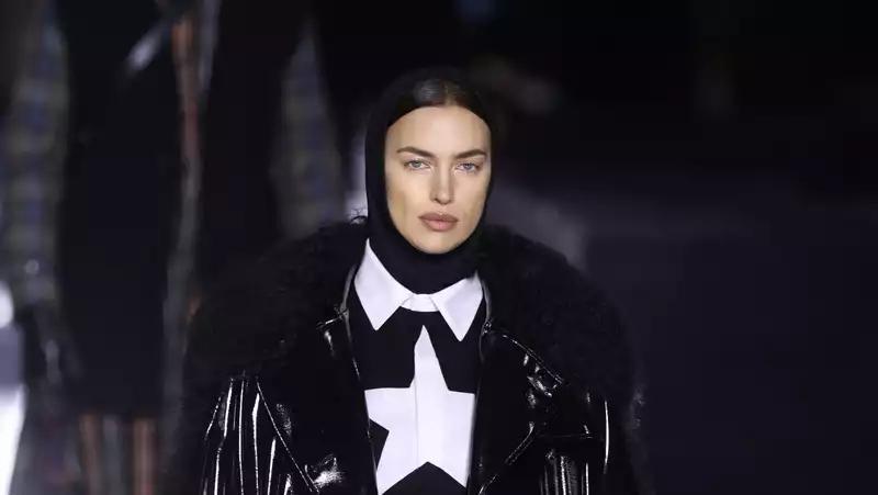 Irina Shayk walks the Burberry runway in the vinyl coat of her dreams.