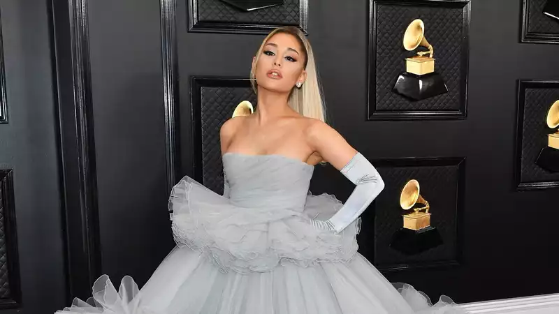 Ariana Grande appears at the Grammy Awards in a Disney Princess outfit.