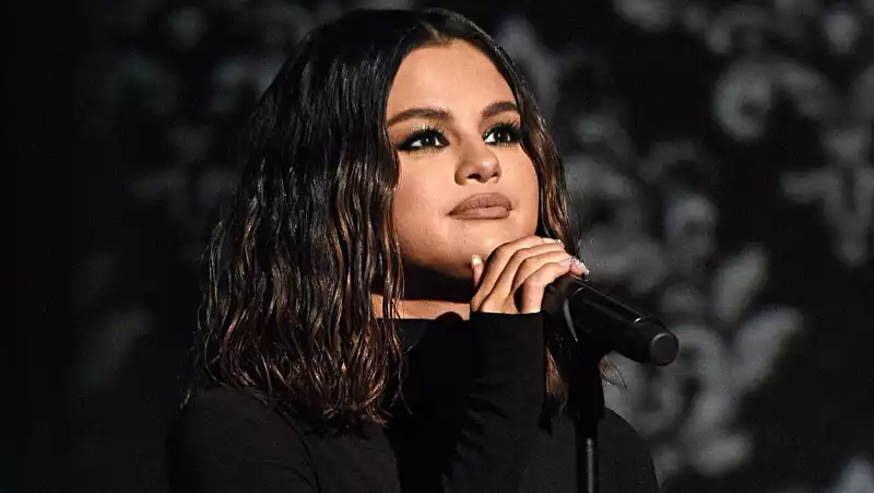 Selena Gomez tears up as she looks back on past loves.