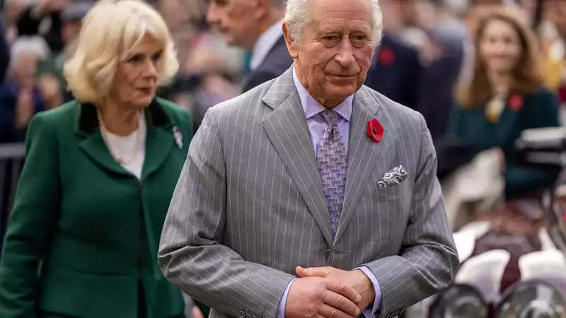 Prince Charles and Queen Camilla are walking and begging