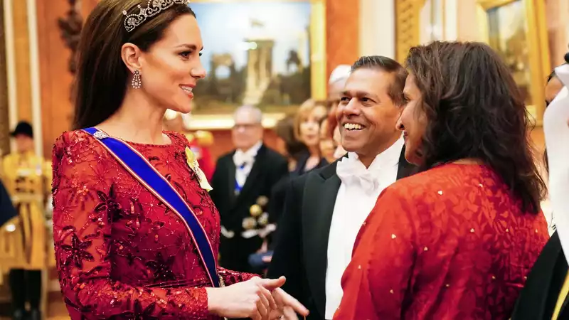 Kate Middleton, a holiday princess in red sequins and a delicate tiara.