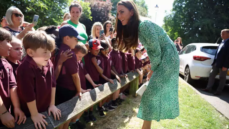 Princess Kate in a leopard print dress for the summer heat.