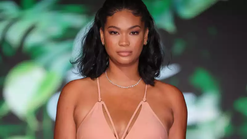 Supermodel Chanel Iman shows off her baby belly on the Miami Swim Week runway.