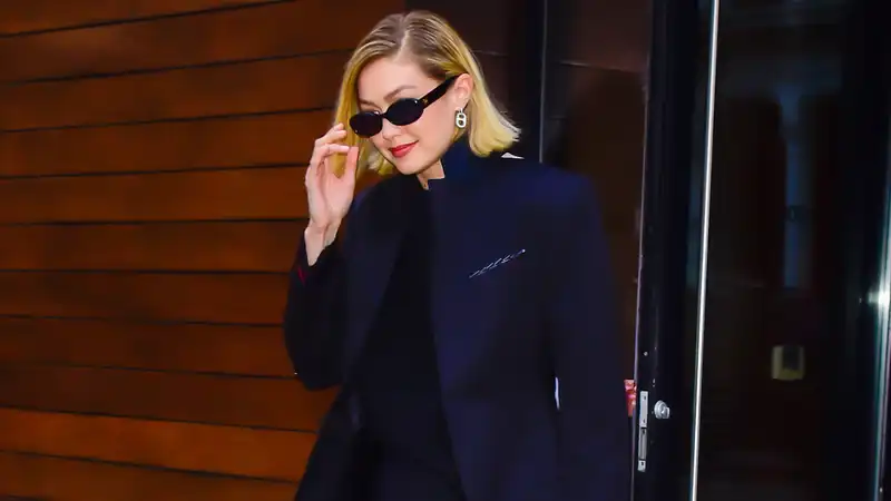 Gigi Hadid looks business casual in leggings and blazers.