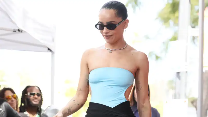 Zoëkravitz turns a cropped Saint Laurent swimsuit into a red carpet top.