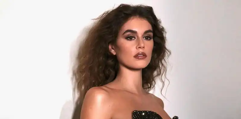 Kaia Gerber ditches the Oscar red carpet in a disco maxi dress.