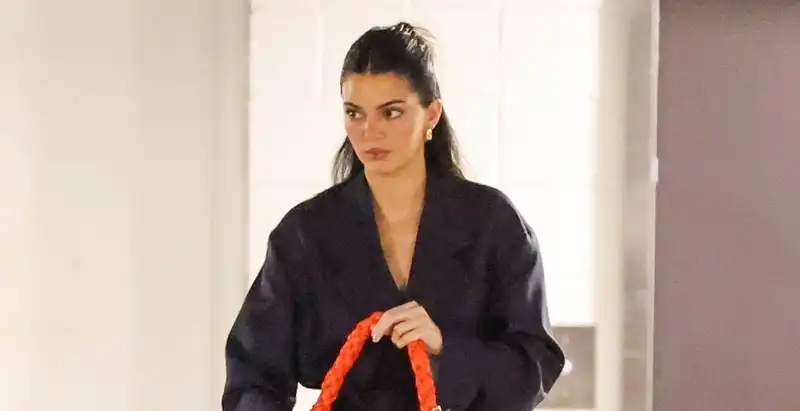 Kendall Jenner's navy suit and orange bag are a lesson in color theory