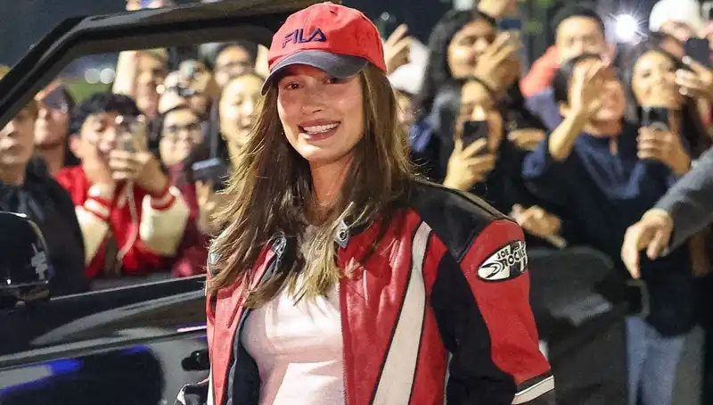 Hailey Bieber pairs her Go-To Maternity crop top with a vintage biker jacket