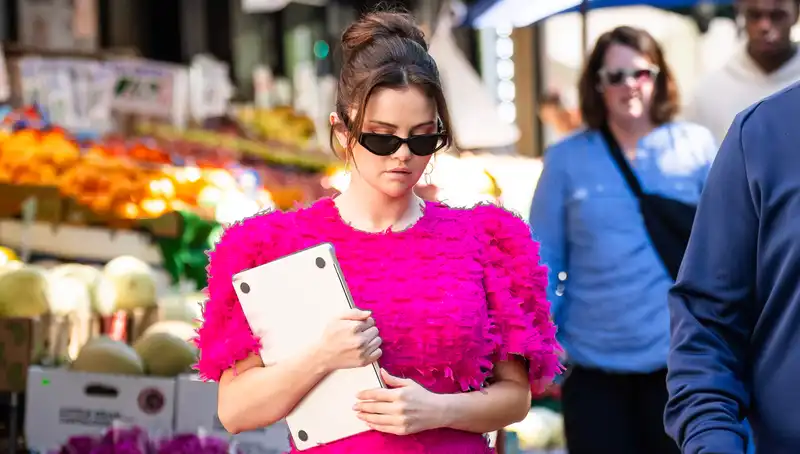 Selena Gomez tests two bright color trends during filming in New York City