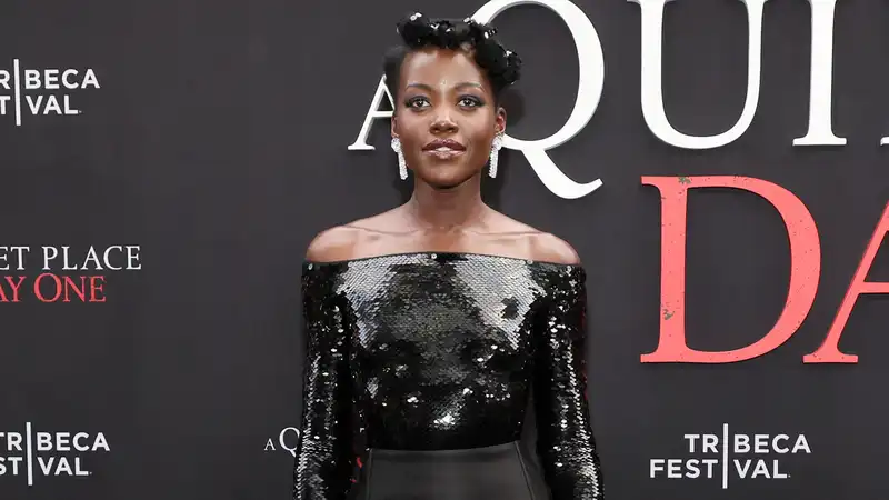 Lupita Nyongo makes noise in custom-made Prada catsuit for "The Quiet Place: Day One" premiere.