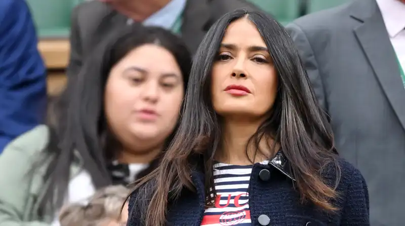 Salma Hayek, wearing a $3,500 tweed blazer with a Gucci striped shirt for the perfect Wimbledon chic