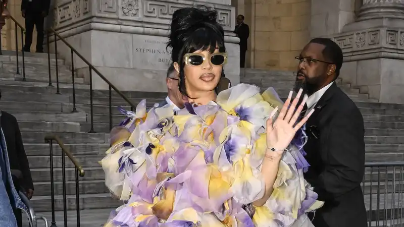 Cardi B. looks like a summer bouquet in a floral mini dress and sky-high heels