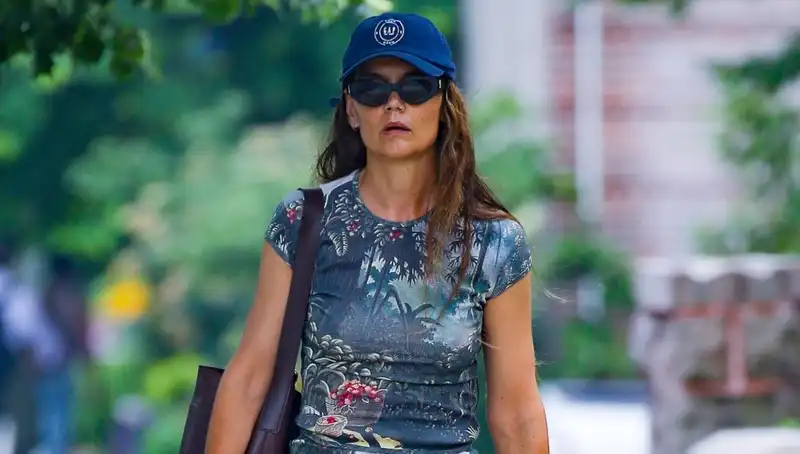 Katie Holmes dresses down her tropical matching set with a Gap baseball cap