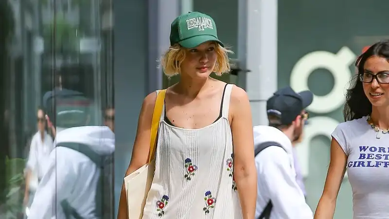 Gigi Hadid proves that a $2,200 floral dress and nostalgic $60 Vans sneakers are a perfect match