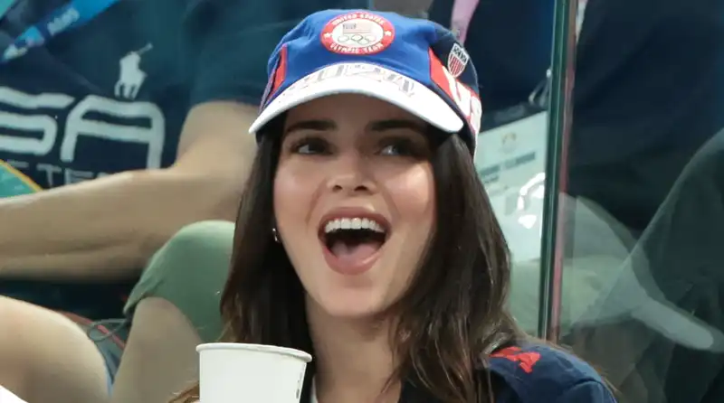 Kendall Jenner wears Olympic gold slip skirt with $650 flip flops