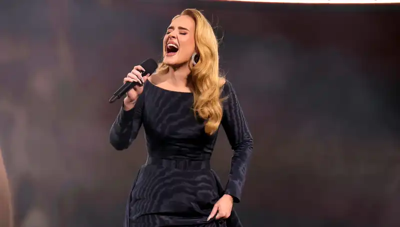 Adele Kicks Off Munich Concert Series in Tailored Dress with Hidden Skirt Detail