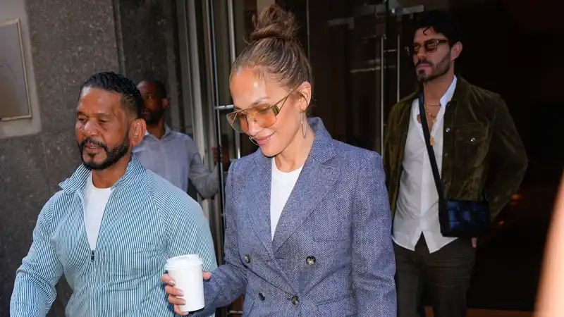 Jennifer Lopez does business in her favorite denim and $20,000 Birkin bag