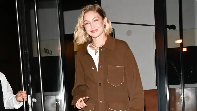 Gigi Hadid in a chocolate brown teddy bear-like dress for dinner in New York City.