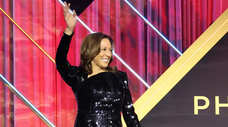 Kamala Harris, wearing a custom sequined gown, addresses the Congressional Black Caucus.