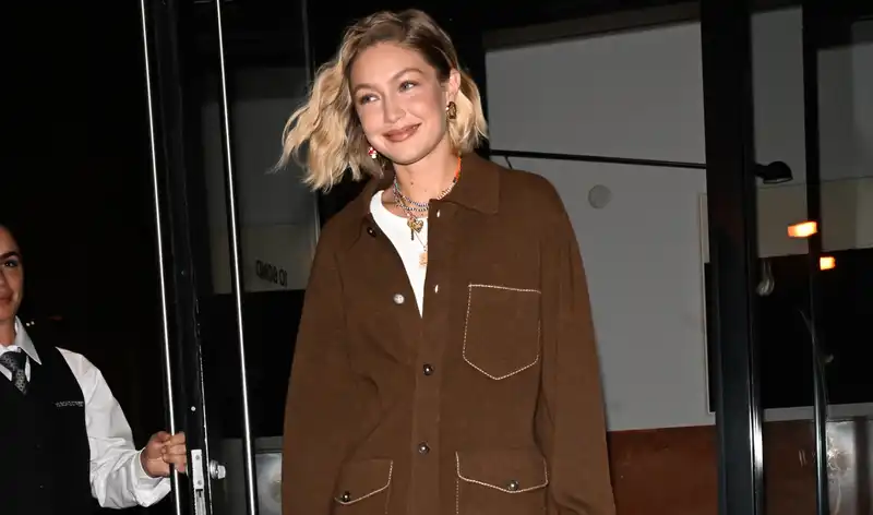 Gigi Hadid casually shows off her mom style with camo print and trucker hat