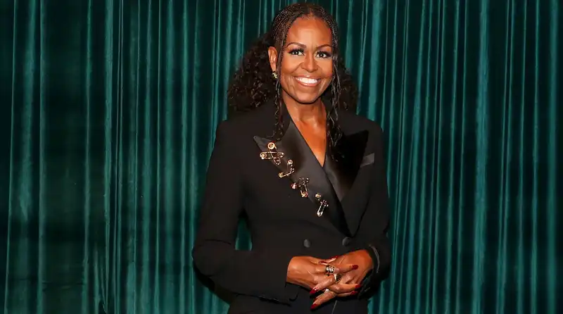 Michelle Obama on the red carpet in a Versace suit with a safety pin.