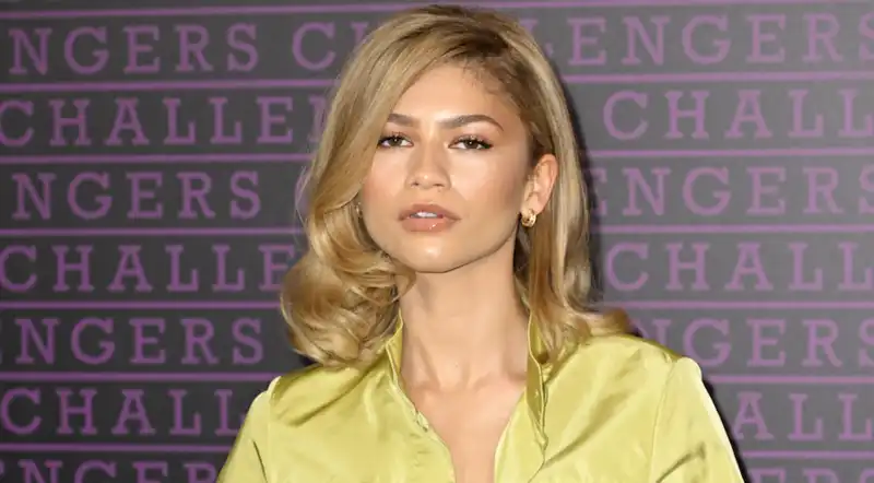 Zendaya does a 180 on street style with classic white sneakers and trendy parachute pants