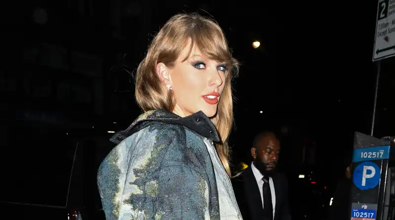 Taylor Swift, best dressed for a wedding in a glittering silver dress.