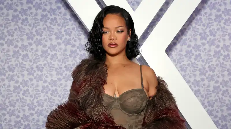 Rihanna glamorous in a gorgeous lace bodysuit and fur coat