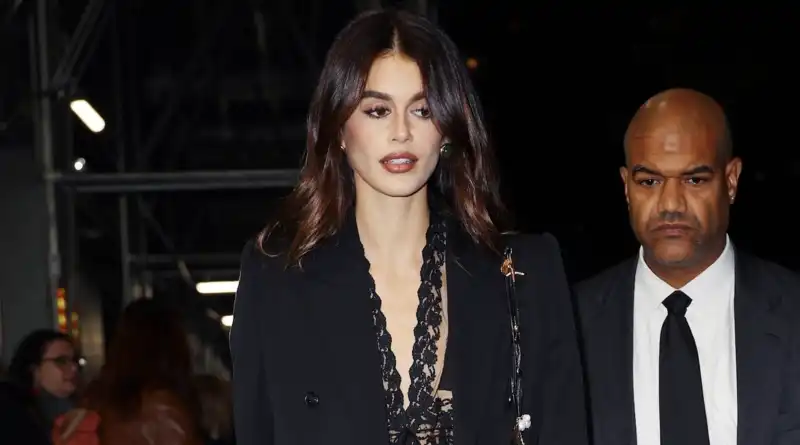 Kaia Gerber ditches her favorite low-rise jeans for lace lingerie and a two-piece suit.