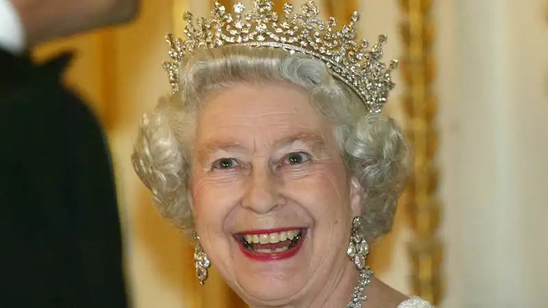 Why Queen Elizabeth took the “Water Chute Slide” in her “evening gown and tiara”?