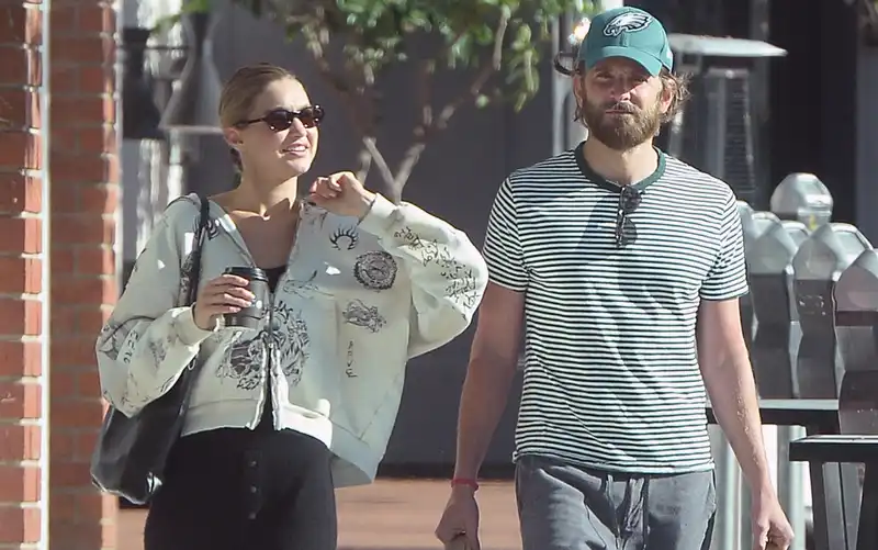 Gigi Hadid and Bradley Cooper officially endorse their love for Erewhon in casual matching outfits.