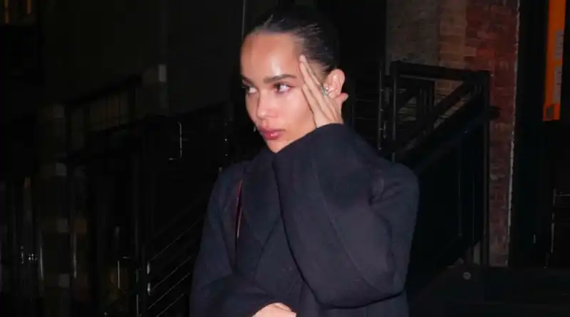 Zoe Kravitz elevates her post-breakup style in a lace skirt alongside Taylor Swift.