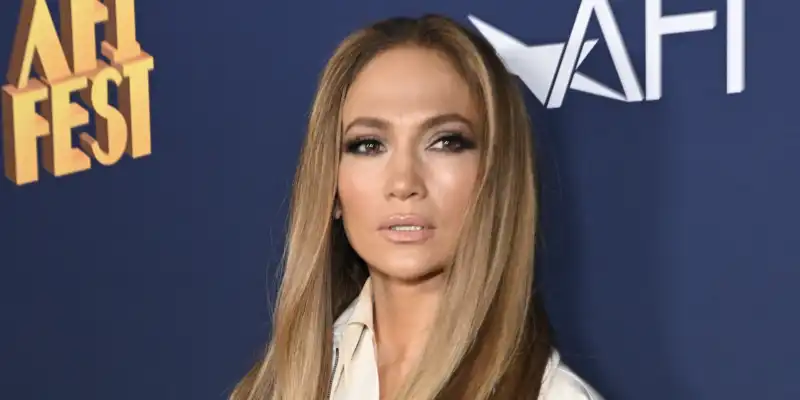 Jennifer Lopez wears a Democratic blue hat and Jacqu1,050Jacquemus bag before election day